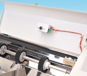 This is an image of 508A paper folder's double feed detection system. This sensor prevents mis-folded papers from being contaminated to outputs.